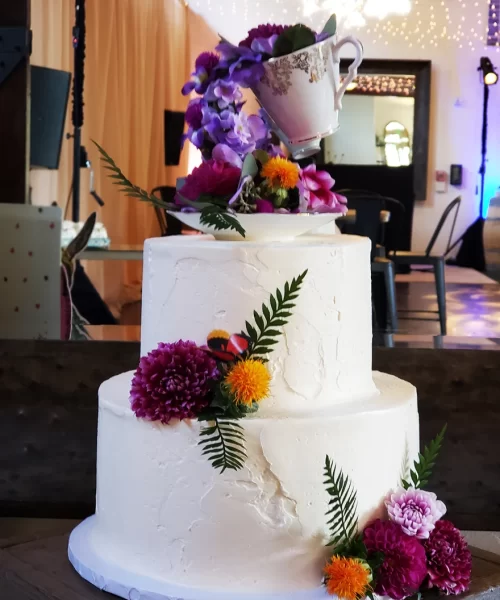 Custom Order Three-Tiered Wedding Cake with Flowers from Bella Bakery